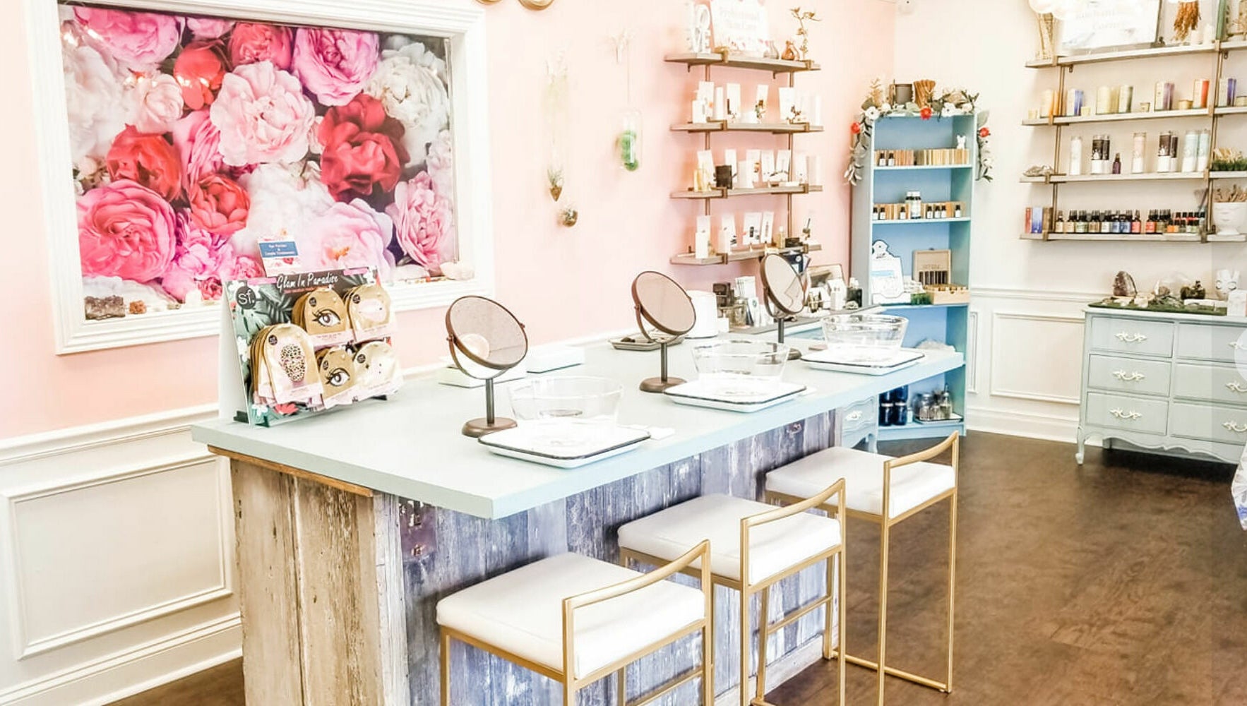 Inviting makeup station at Spa Liz and Co., Greenfield, Wisconsin, US with floral decor and beauty products.