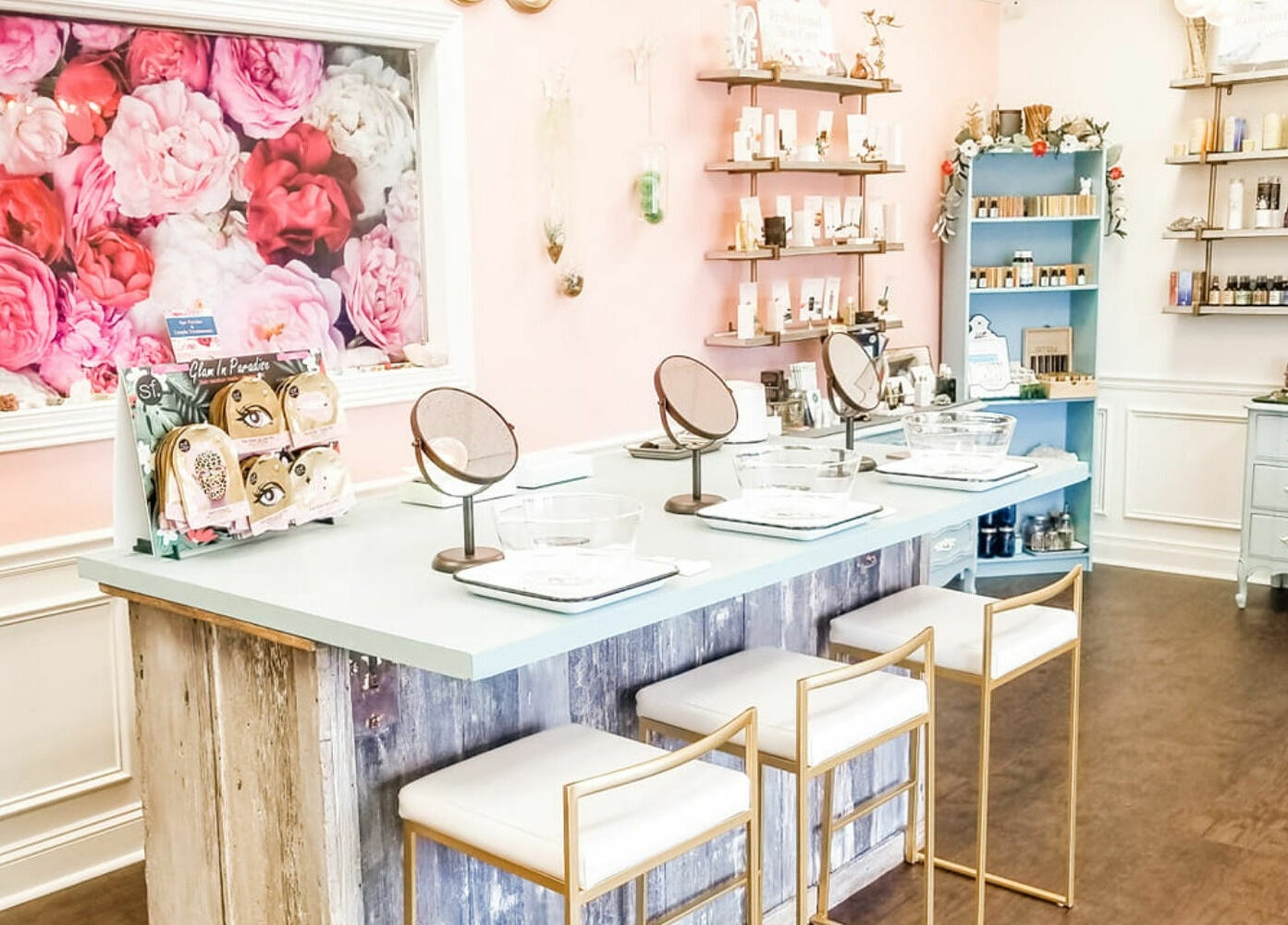 Inviting makeup station at Spa Liz and Co., Greenfield, Wisconsin, US with floral decor and beauty products.