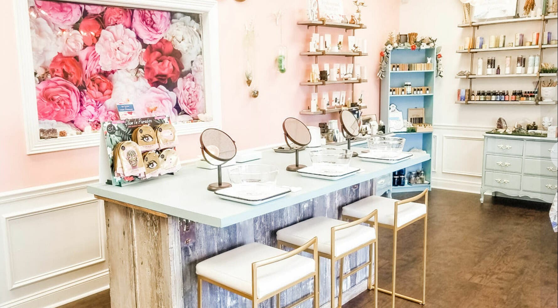 Inviting makeup station at Spa Liz and Co., Greenfield, Wisconsin, US with floral decor and beauty products.