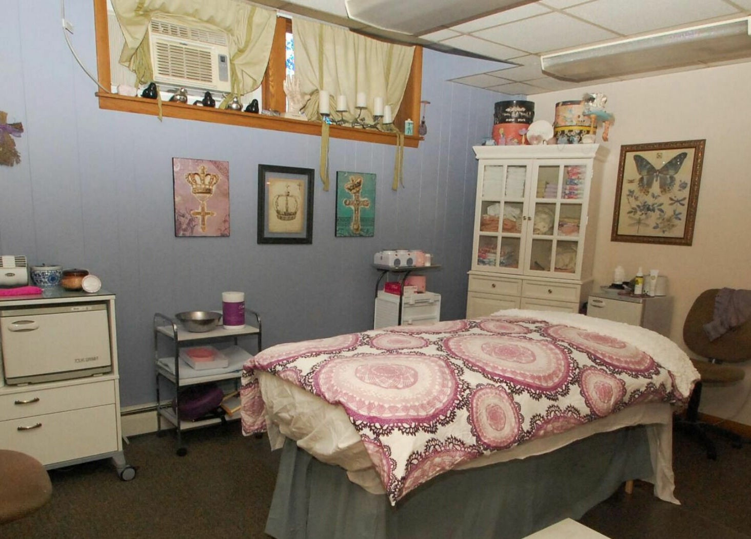 Cozy treatment room at Spa Liz and Co., Greenfield, Wisconsin, US, featuring soothing decor and a massage table.