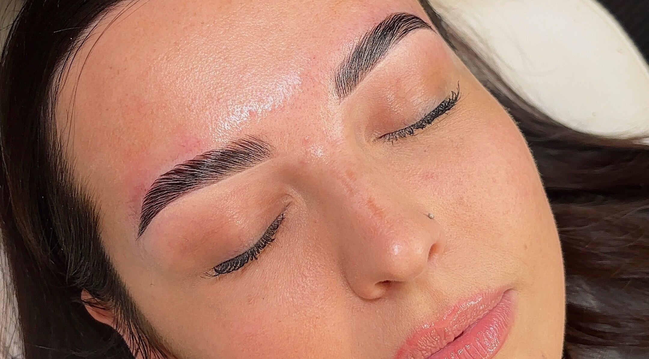 Close-up of perfectly shaped eyebrows at Makeup and Beauty by Jenna, Moyraverty, Northern Ireland, GB.