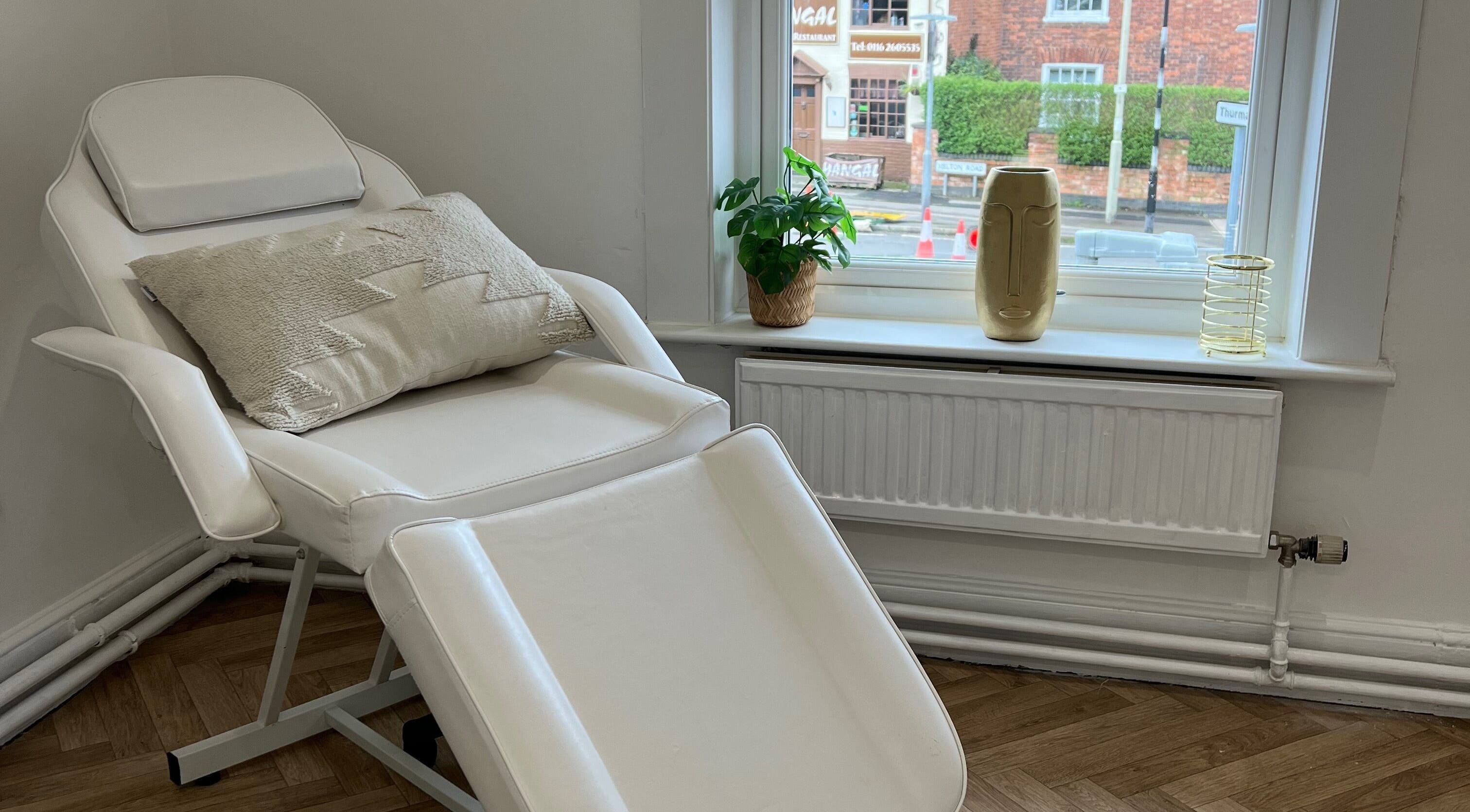Relaxing spa chair at GLO by Holly-mae, Syston, England, GB near a window with decor.