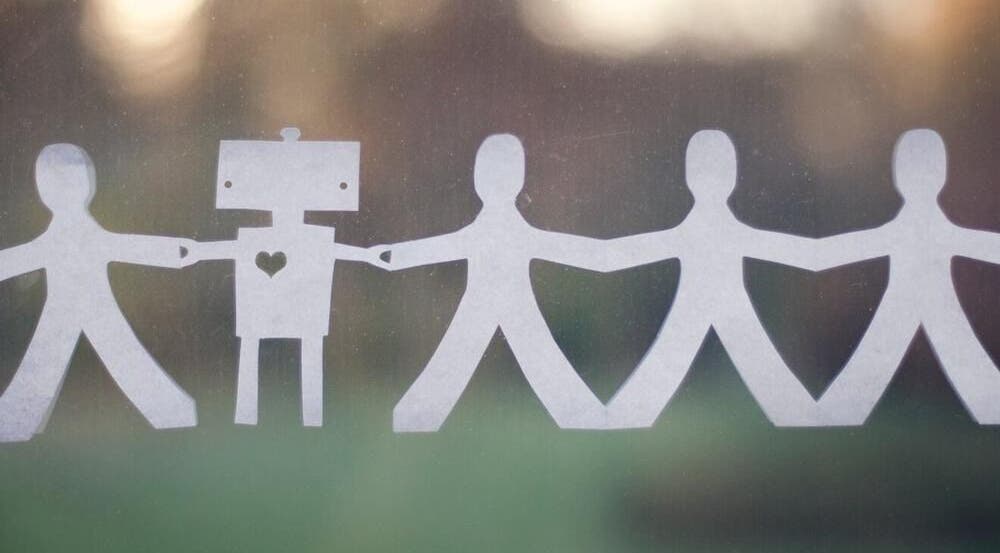 Paper figures holding hands symbolizing community at Beyond the Chair, Pretoria, Gauteng, ZA.