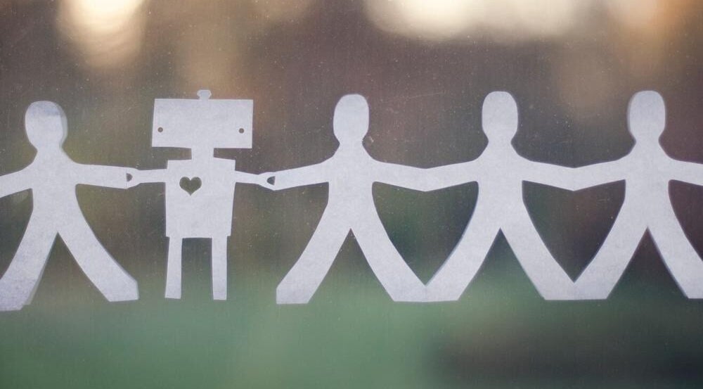 Paper figures holding hands symbolizing community at Beyond the Chair, Pretoria, Gauteng, ZA.