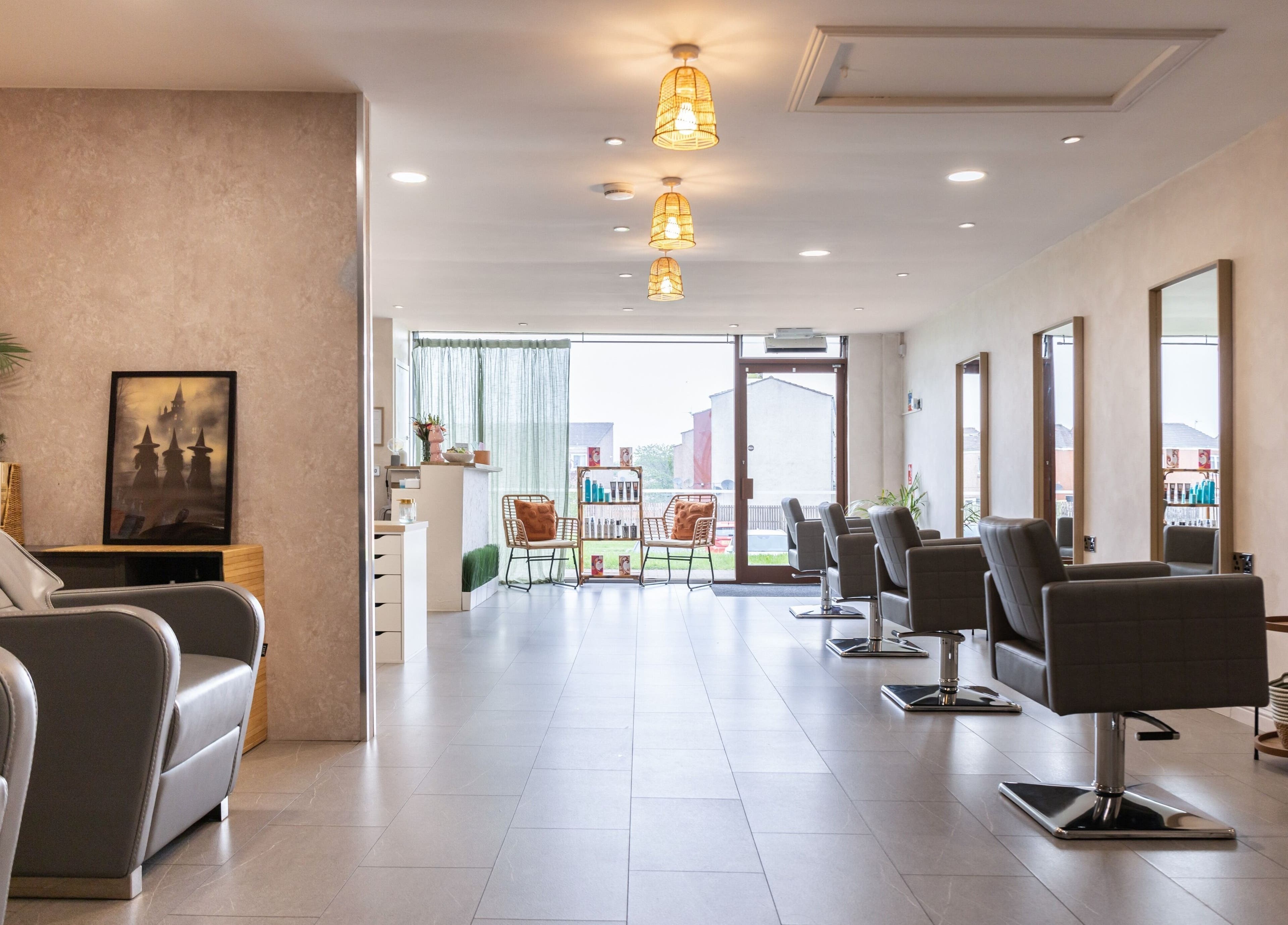Elegant interior of Neptune salon, Livingston, Scotland, GB showcasing modern hair styling chairs.