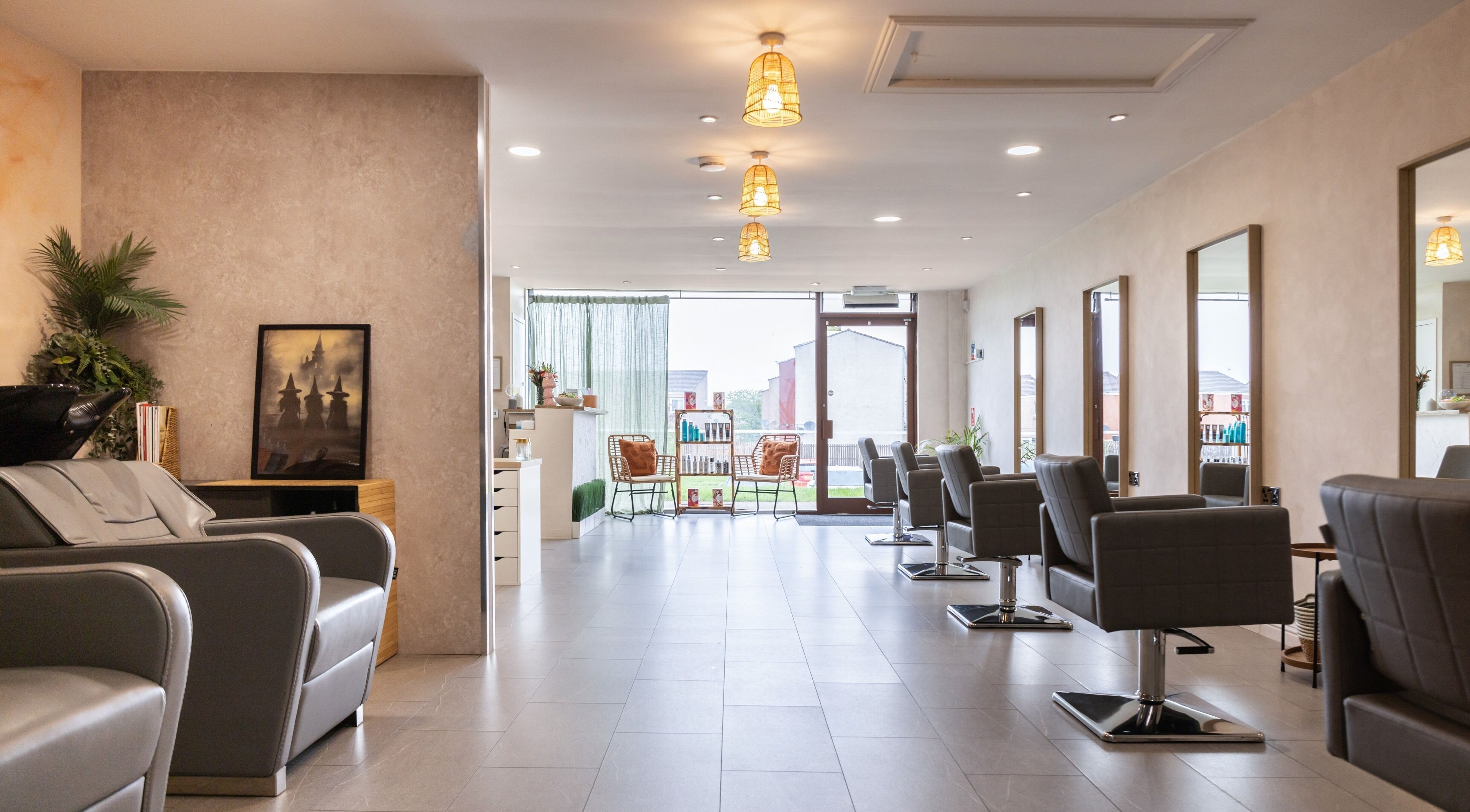 Elegant interior of Neptune salon, Livingston, Scotland, GB showcasing modern hair styling chairs.