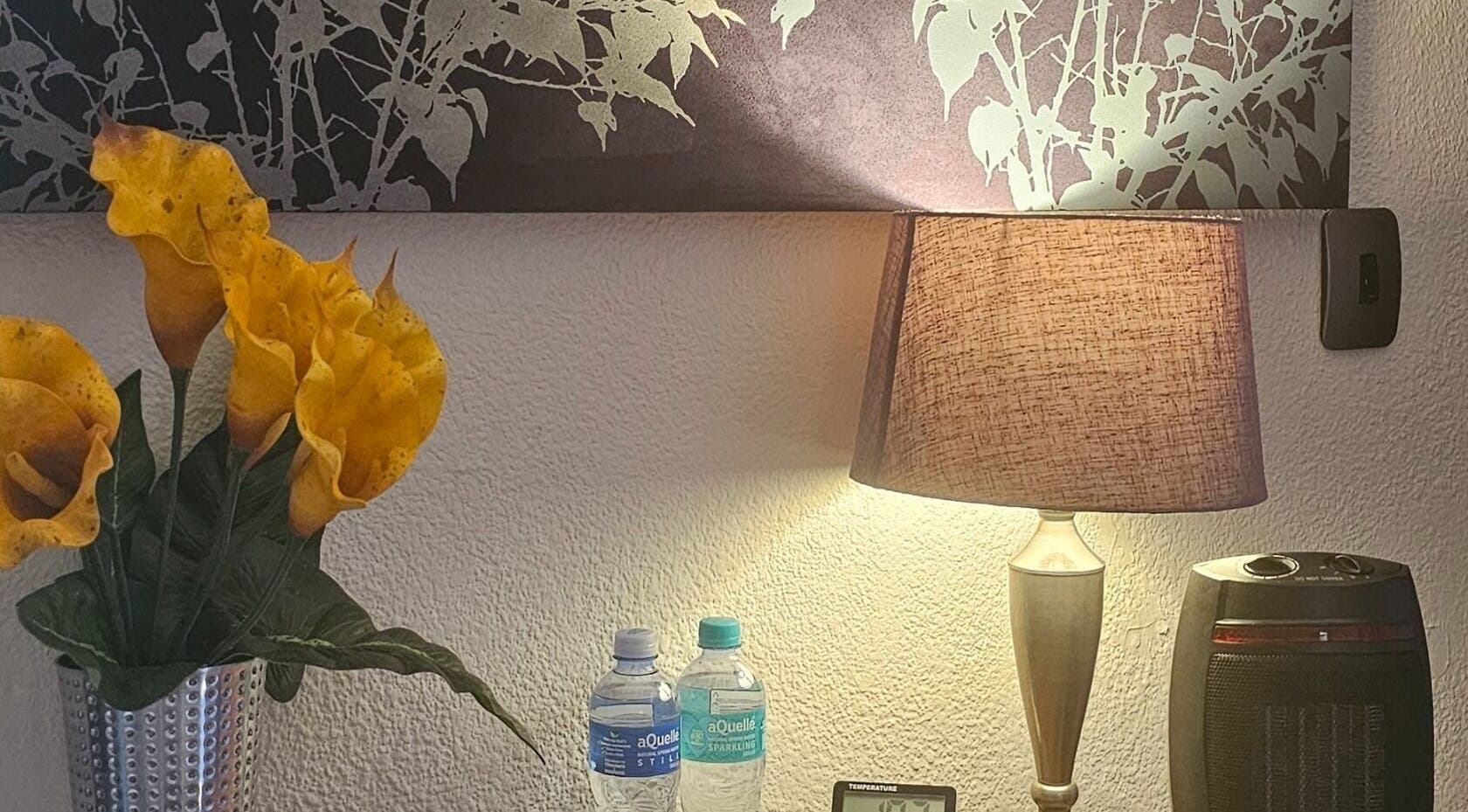 Warm, inviting decor with flowers and a lamp at Andy Massage Therapist, Kempton Park, Gauteng, ZA.