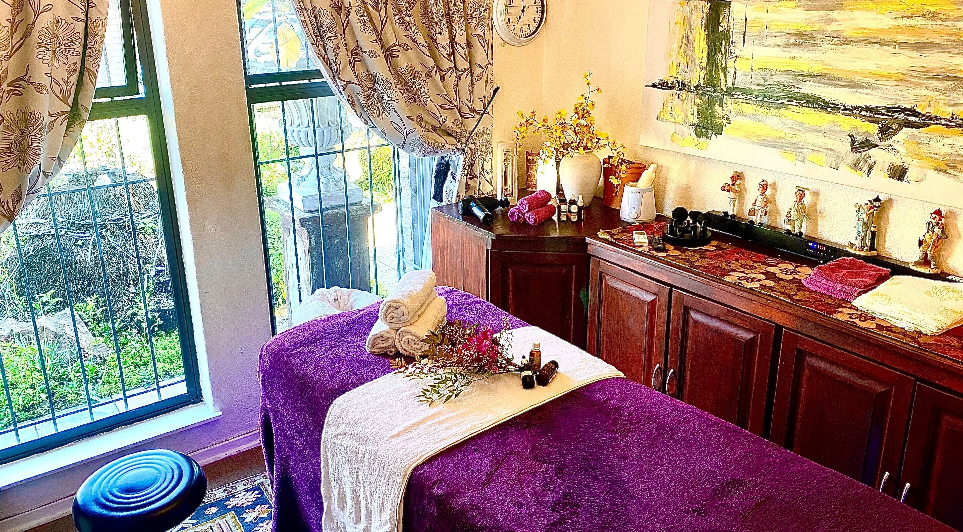 Tranquil massage room at Andy Massage Therapist, Kempton Park, Gauteng, ZA with purple decor and cozy ambiance.