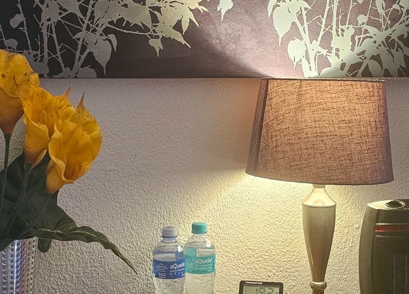 Relaxing decor at Andy Massage Therapist, Kempton Park, Gauteng, ZA, featuring a lamp and yellow flowers.