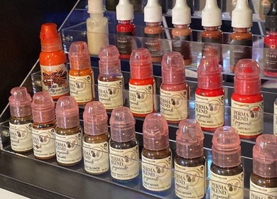 A variety of pigment bottles displayed at Anora Beauty Studio, Riyadh, Riyadh Province, SA.