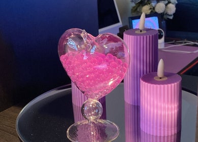 Heart-shaped decor with pink beads and candles at Anora Beauty Studio, Riyadh, Riyadh Province, SA.