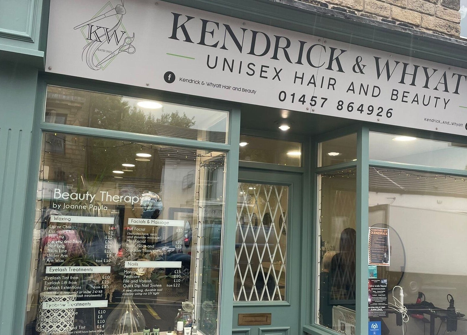 Front view of Kendrick and Whyatt Hair Studio in Glossop, England, showcasing elegant decor and welcoming entrance.