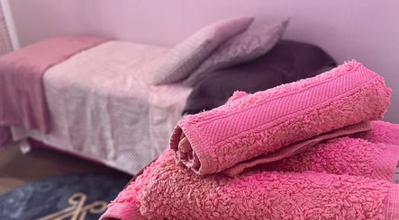 Relaxing spa bed with pink towels at All About You, St Austell, England, GB.