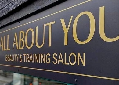 All About You salon sign, St Austell, England, GB, showcasing beauty and training services.