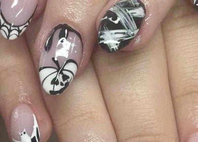 Elegant black and white nail art at All About You, St Austell, England, GB.