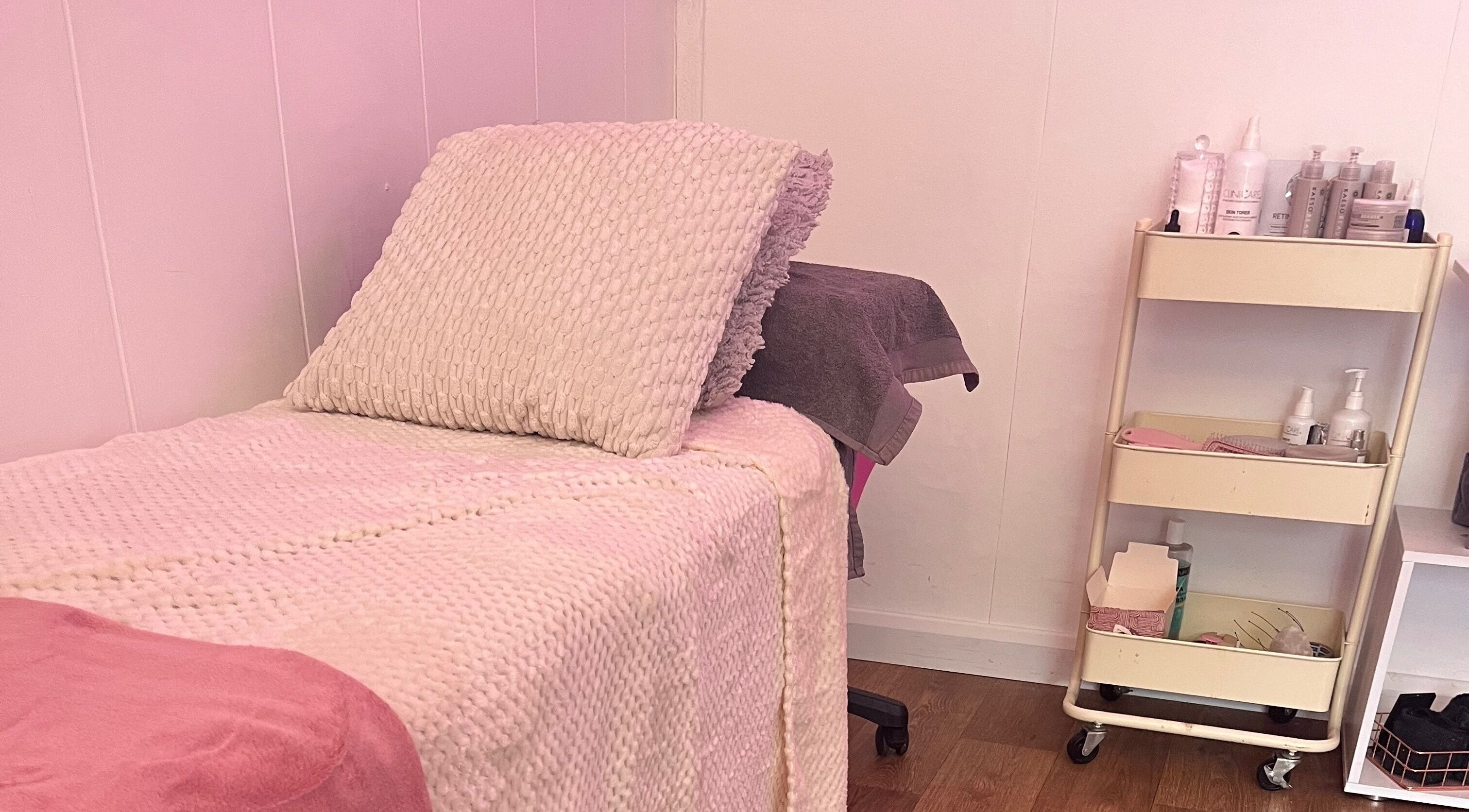 Cozy treatment bed at All About You, beauty salon and academy in St Austell, England, GB.
