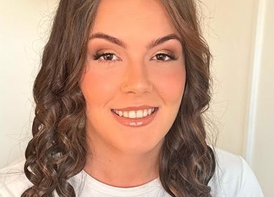 Smiling woman with styled hair at Beauty By Becca Felton, Aberdare, Wales, GB.