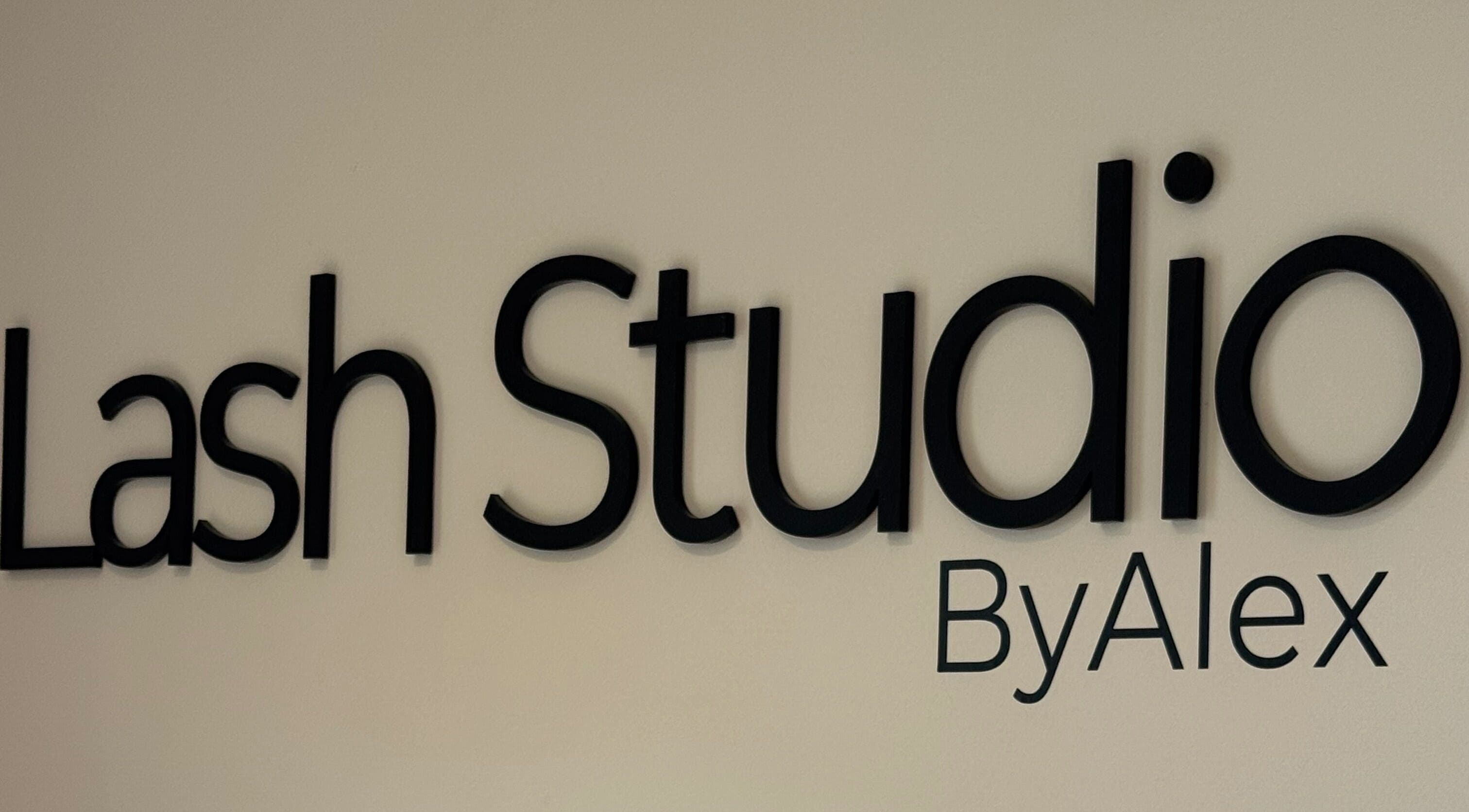 Lash & Brow Studio sign displaying ByAlex at Loughton, England, GB entrance wall.