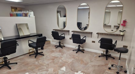Elegant salon interior of Lavender Hill Hair Design, Celbridge, County Kildare, IE, featuring sleek mirrors and styling chairs.
