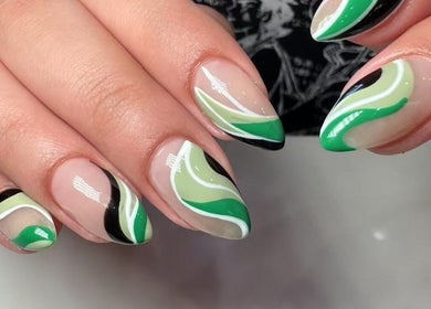 Stylish green and black swirl nail art design at Oasis Nail Spa Windermere, Orlando, Florida, US.