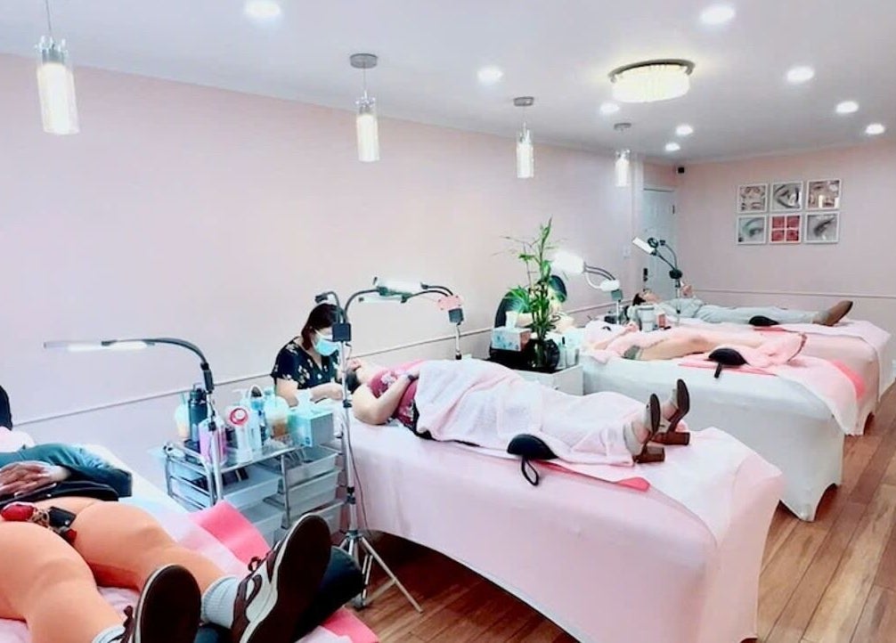Clients relaxing at Spring Lashes and Brows in San Jose, California, US. Elegant treatment beds and serene ambiance.