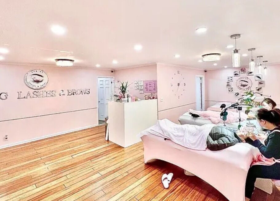 Interior of Spring Lashes and Brows in San Jose, California, US showing treatment area, pink decor, and staff.