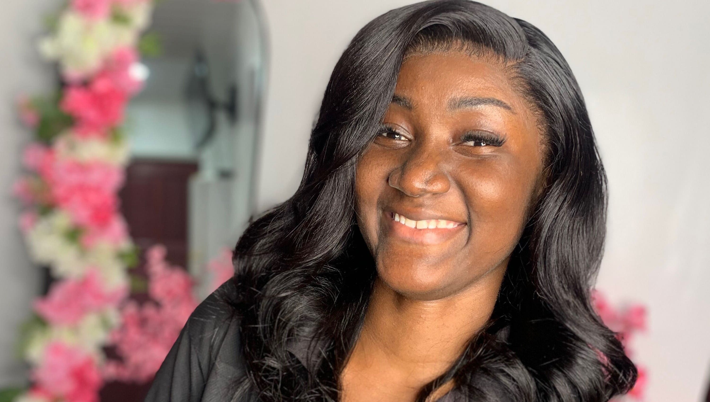 Happy woman with styled hair at Nella Luxe Zone, Georgetown, Demerara-Mahaica, GY.