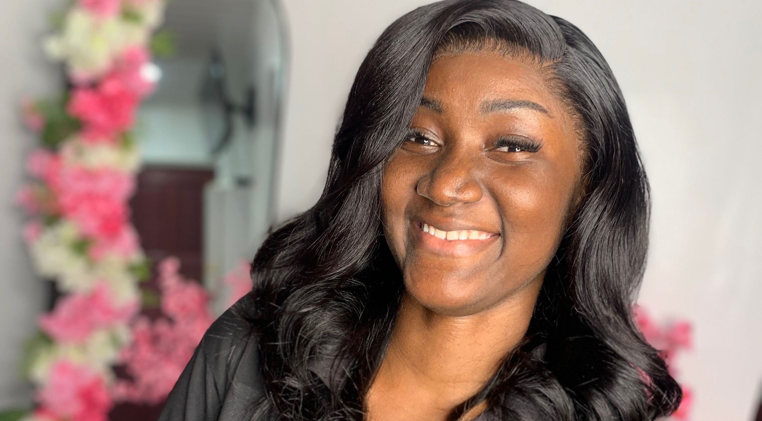 Happy woman with styled hair at Nella Luxe Zone, Georgetown, Demerara-Mahaica, GY.