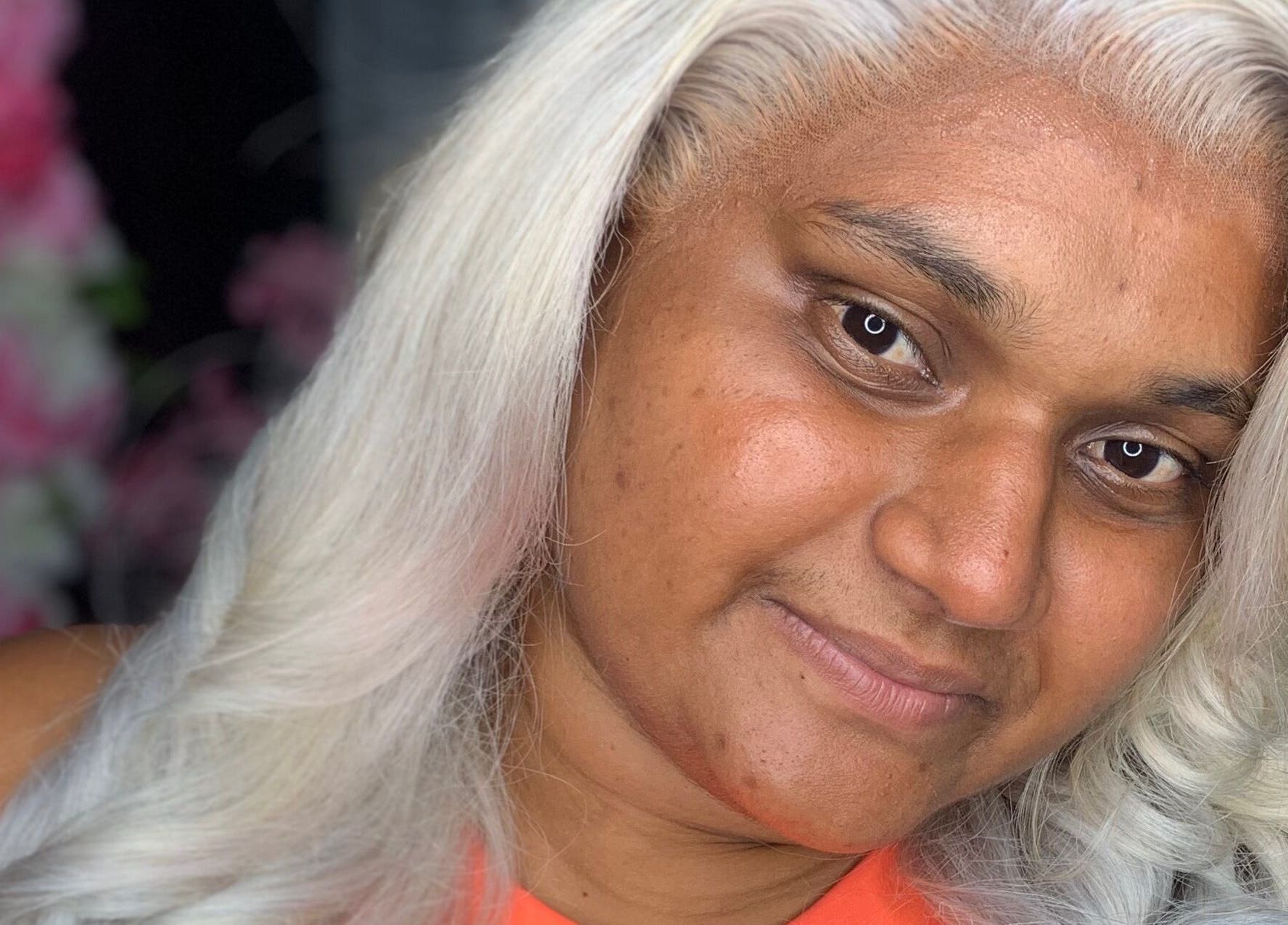 Smiling person with styled white hair at Nella Luxe Zone in Georgetown, Demerara-mahaica, GY.