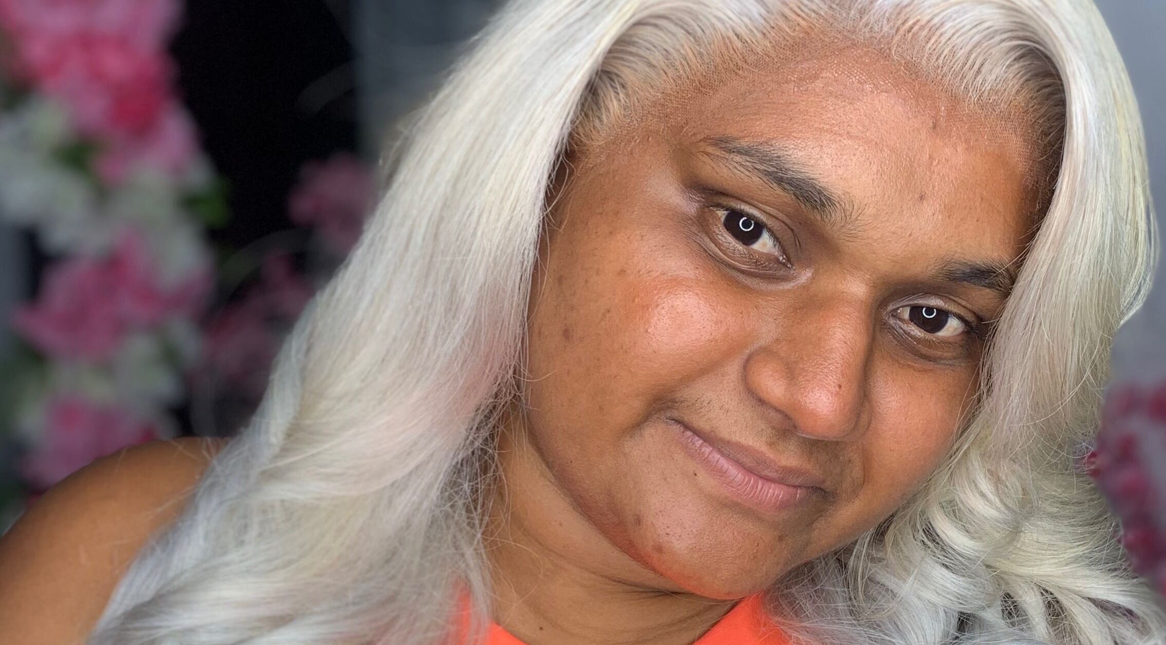 Smiling person with styled white hair at Nella Luxe Zone in Georgetown, Demerara-mahaica, GY.