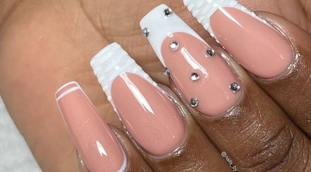 Elegant nail art at Nails by Taamba, Windhoek, Khomas Region, NA. Nude and white nails with rhinestones.