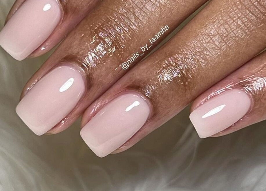 Elegant nude manicure at Nails by Taamba, Windhoek, Khomas Region, NA showcasing glossy finish.