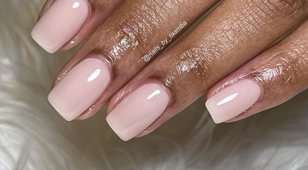 Elegant nude manicure at Nails by Taamba, Windhoek, Khomas Region, NA showcasing glossy finish.