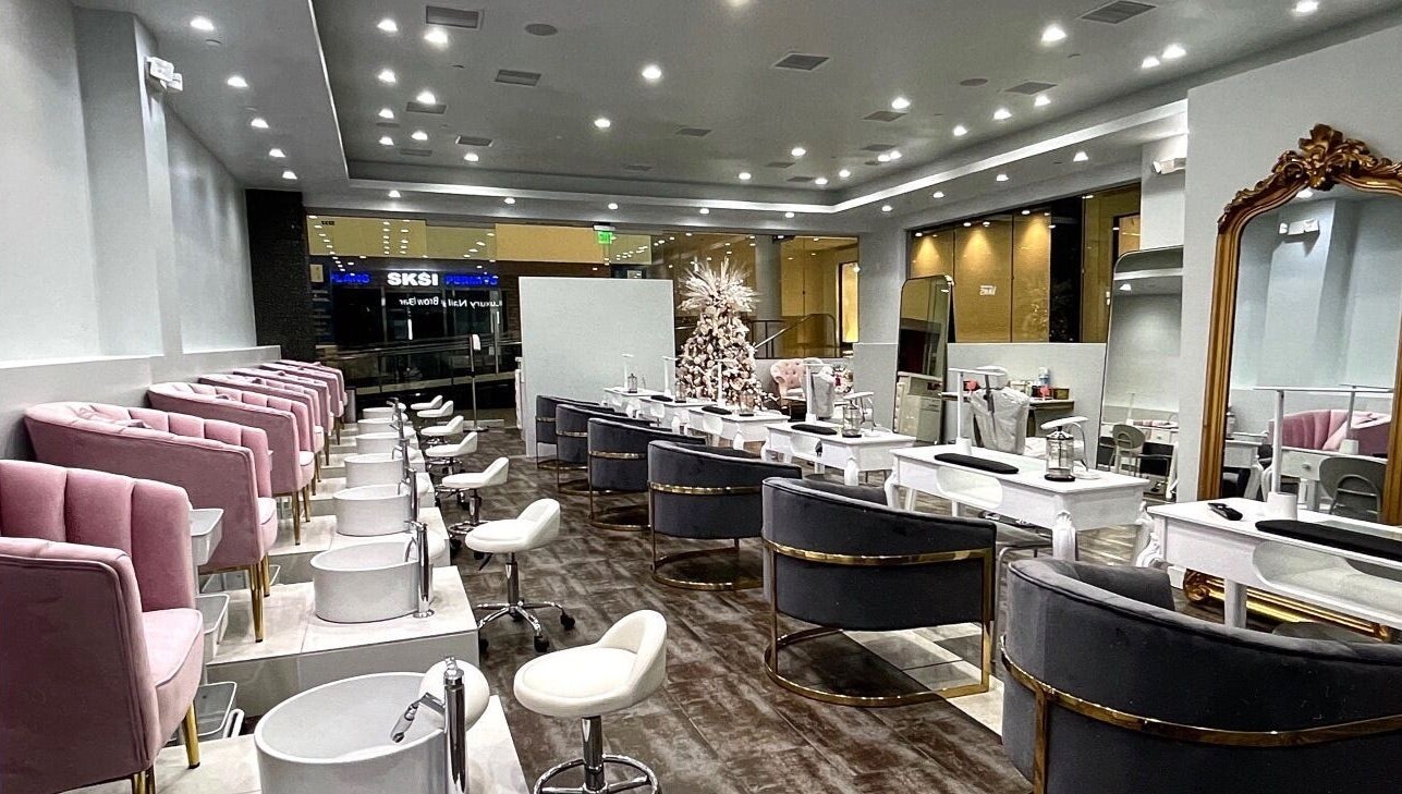 Chic interior of Luxury Nail and Brow Bar in Glendale, California, US with plush seating and modern decor.