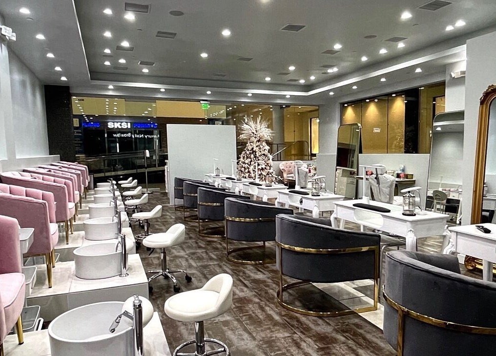 Chic interior of Luxury Nail and Brow Bar in Glendale, California, US with plush seating and modern decor.