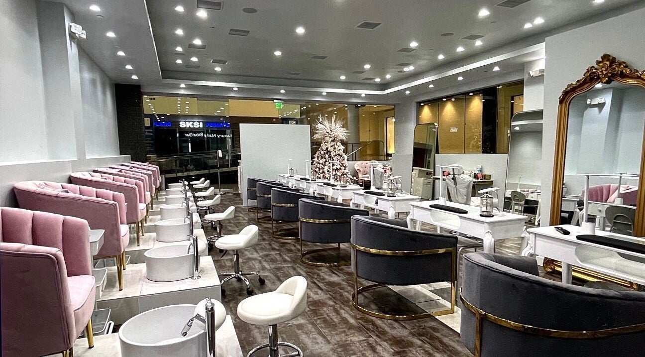 Chic interior of Luxury Nail and Brow Bar in Glendale, California, US with plush seating and modern decor.