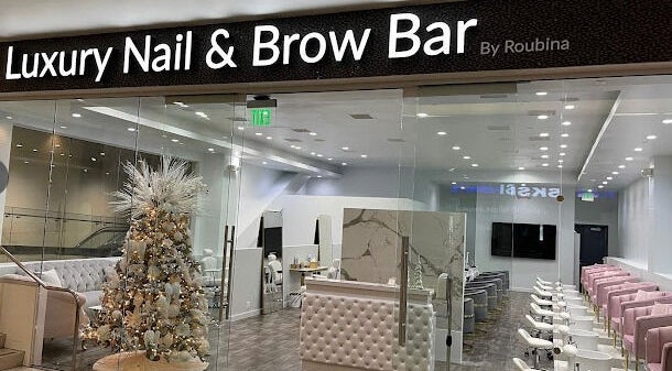 Entrance of Luxury Nail and Brow Bar in Glendale, California, US, showcasing chic interior and a festive decor.