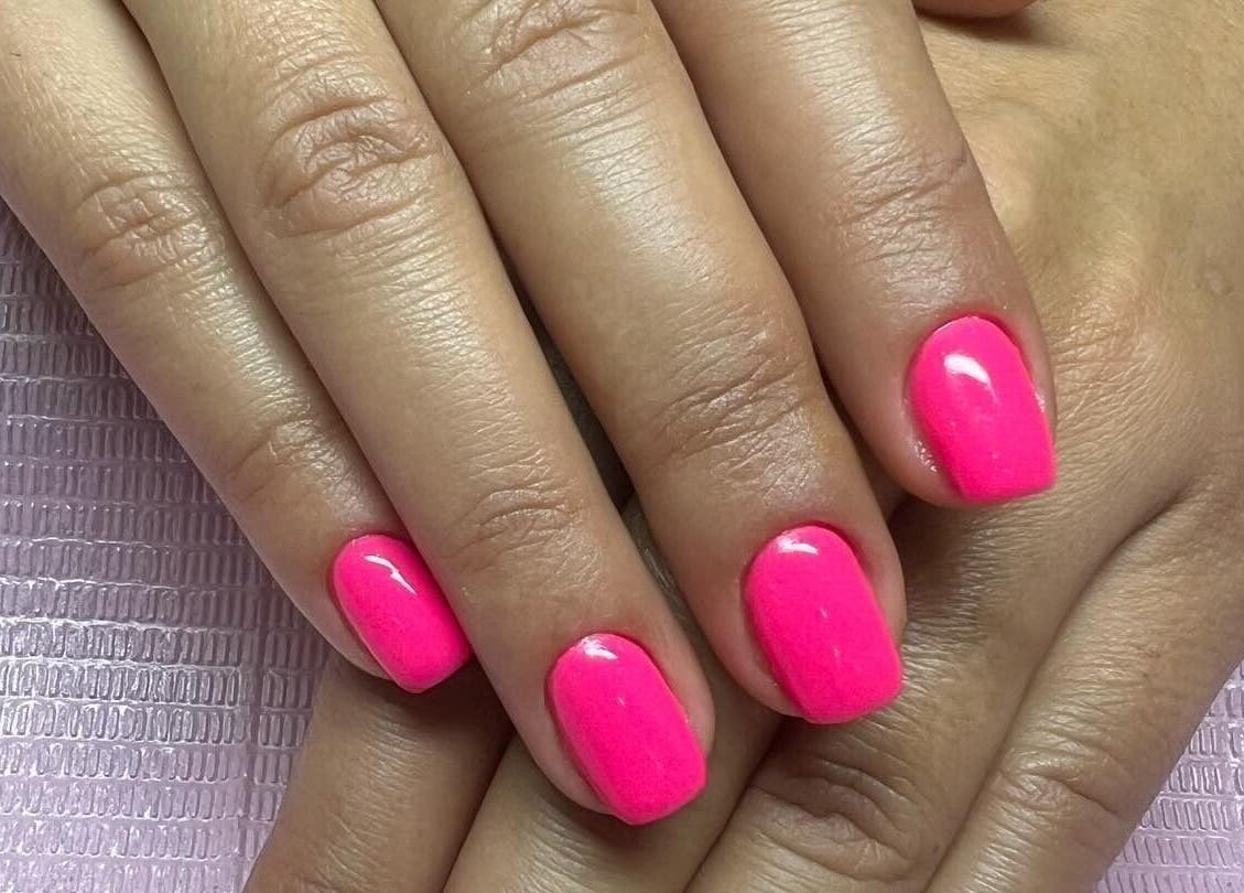 Vibrant pink nails at Luxury Nail and Brow Bar in Glendale, California, US. Perfect for a stylish look.