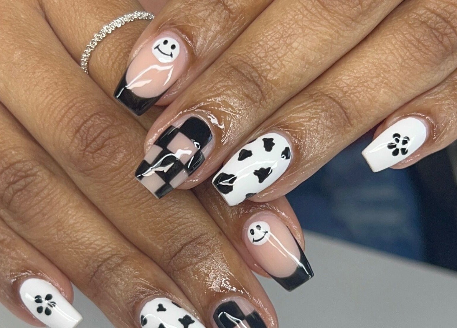 Artistic black and white nail art design at Dazzling Beauty Lounge, Montgomery, Illinois, US.