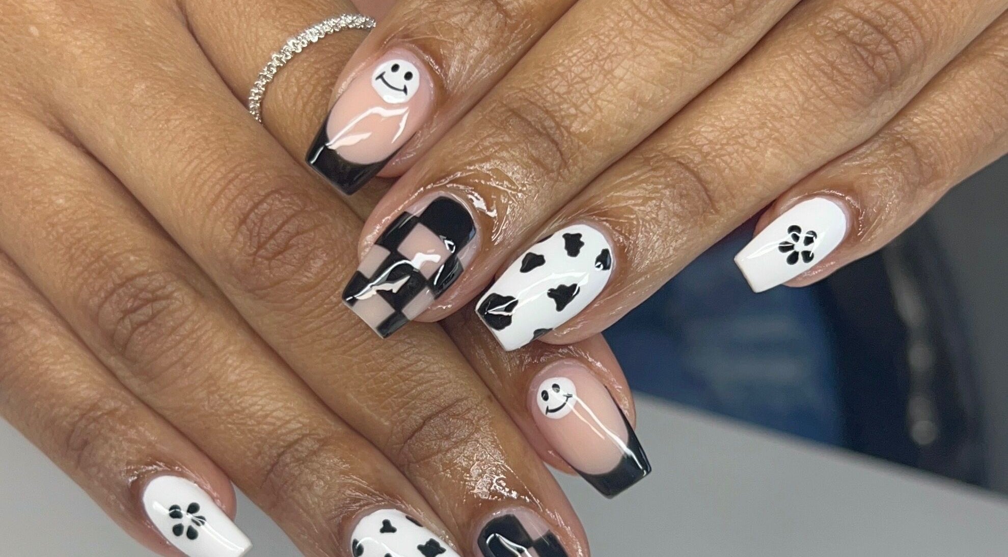 Artistic black and white nail art design at Dazzling Beauty Lounge, Montgomery, Illinois, US.