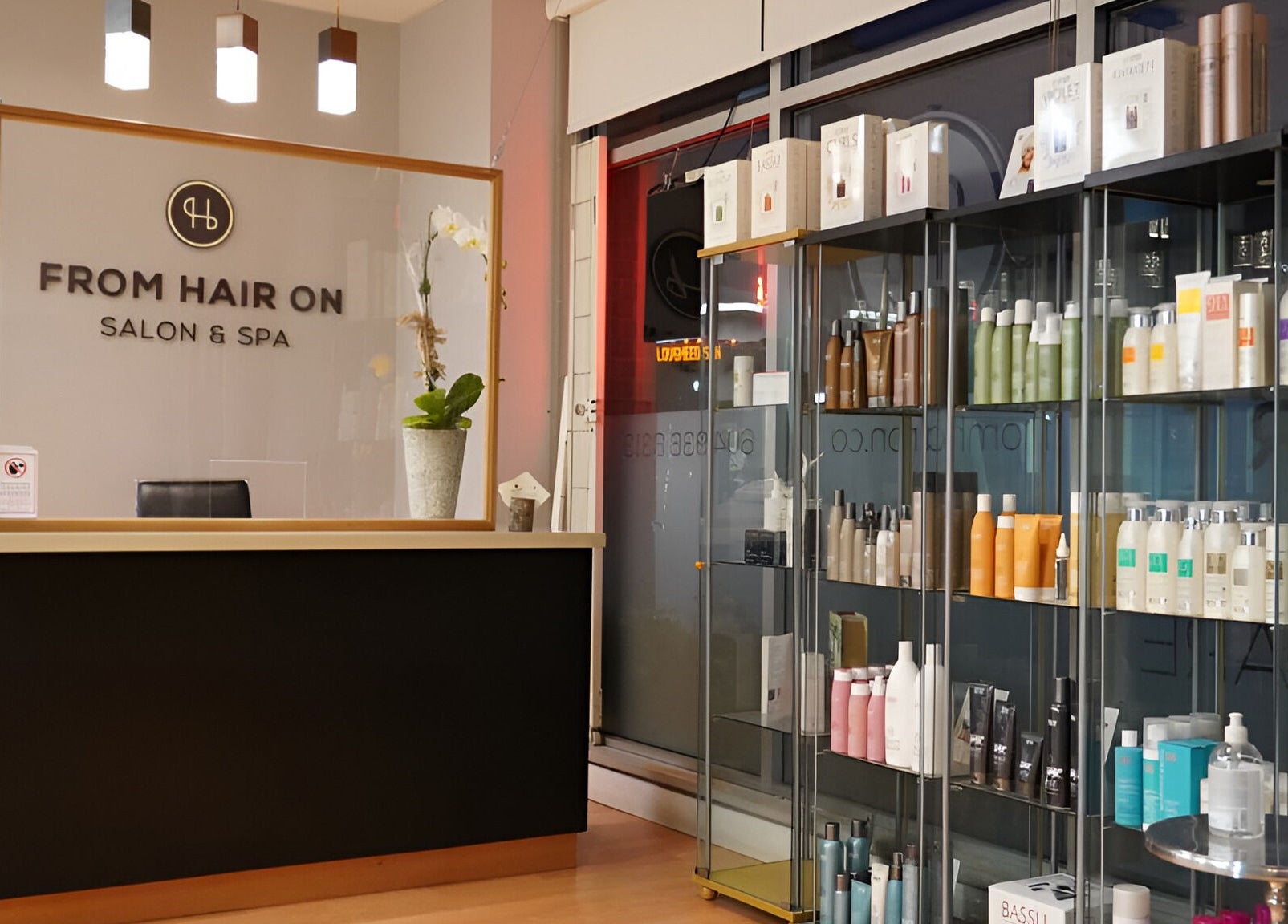 Reception area of From Hair On salon in Port Moody, British Columbia, CA with product shelves.