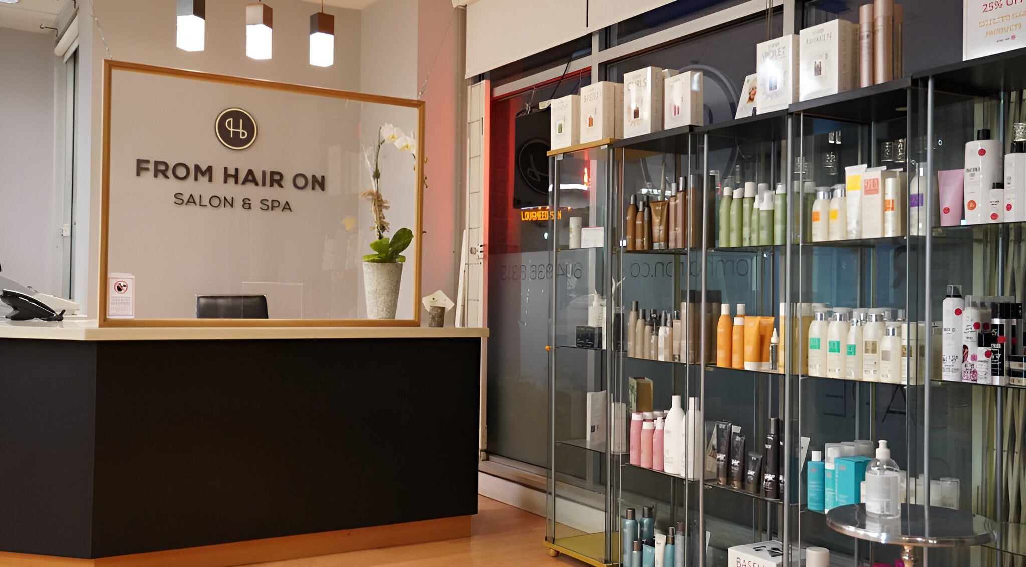 Reception area of From Hair On salon in Port Moody, British Columbia, CA with product shelves.