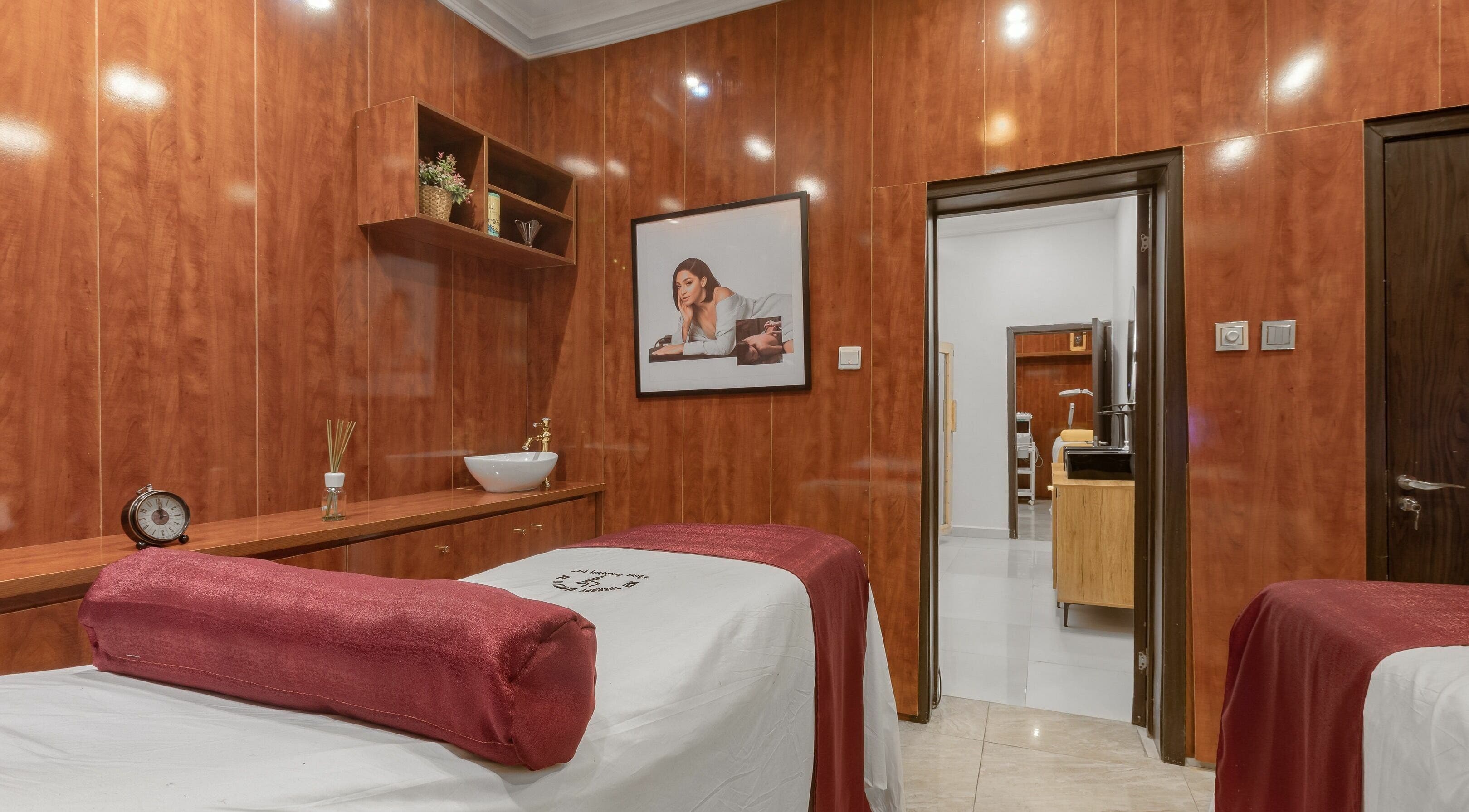 Relaxing spa room at Skin Therapy Beauty And Spa Abuja, featuring warm wood panels, located in Abuja, Federal Capital Territory, NG.