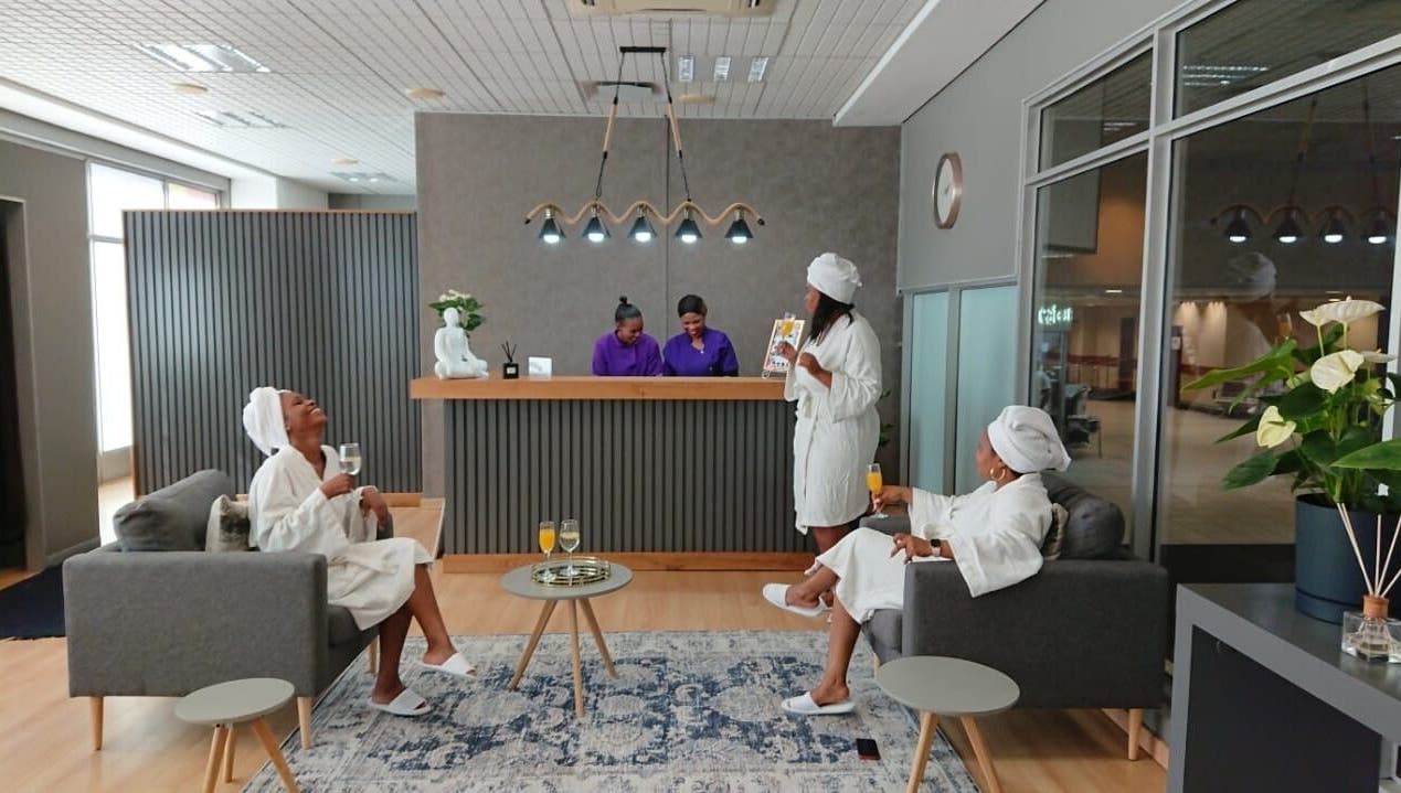 Guests relax in Herspace Wellness PE Airport SPA, Gqeberha, Eastern Cape, ZA, enjoying a calming atmosphere.