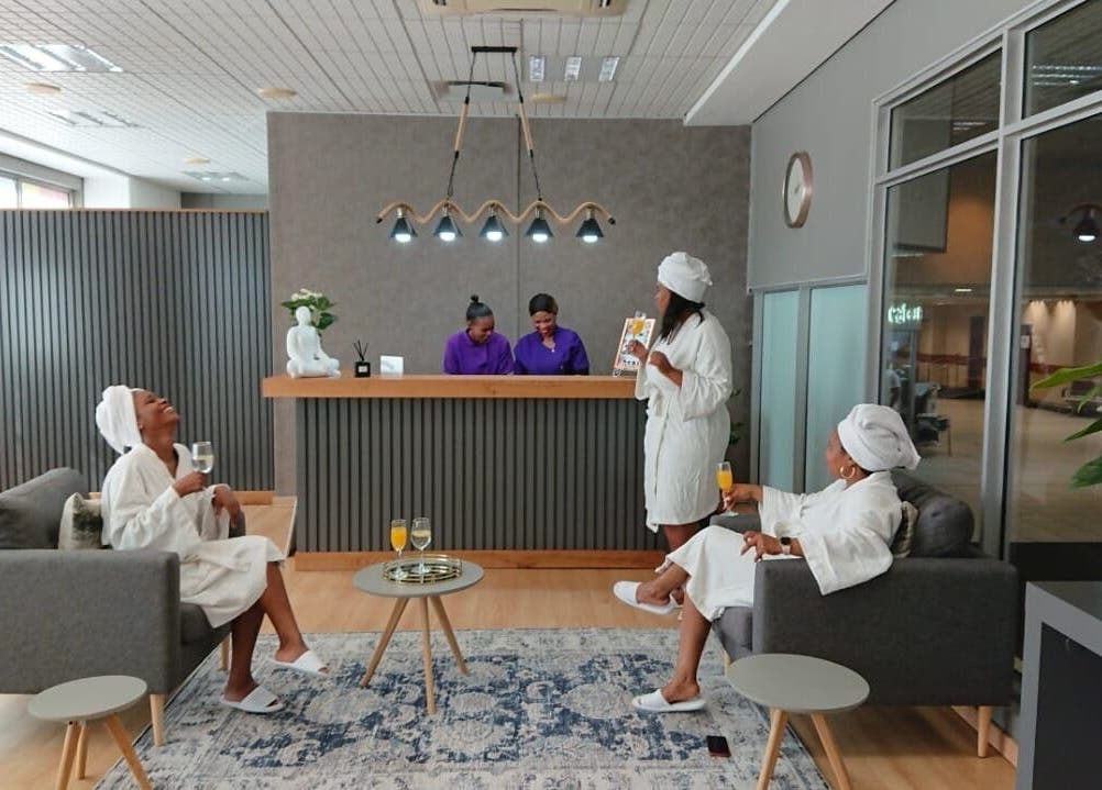 Guests relax in Herspace Wellness PE Airport SPA, Gqeberha, Eastern Cape, ZA, enjoying a calming atmosphere.