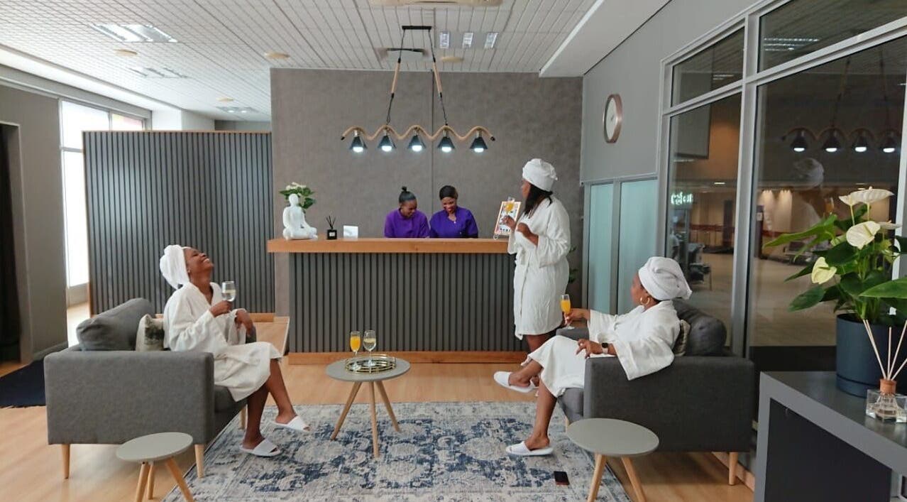 Guests relax in Herspace Wellness PE Airport SPA, Gqeberha, Eastern Cape, ZA, enjoying a calming atmosphere.
