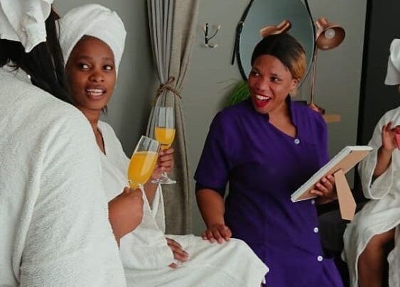 Guests enjoying drinks and conversation at Herspace Wellness PE Airport SPA in Gqeberha, Eastern Cape, ZA.