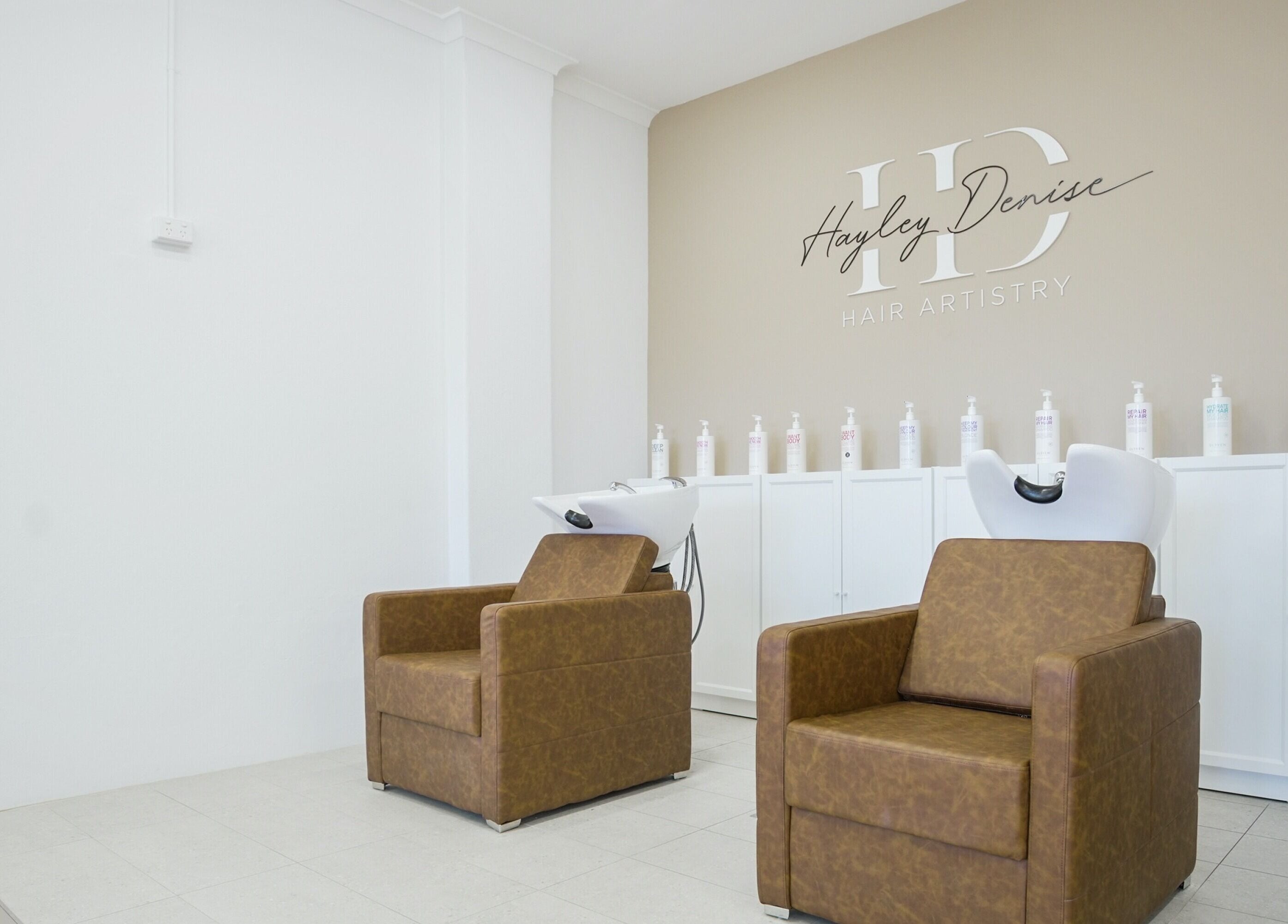 Comfortable salon chairs at HD Hair Artistry in Yokine, Western Australia, AU, showcasing a modern design.