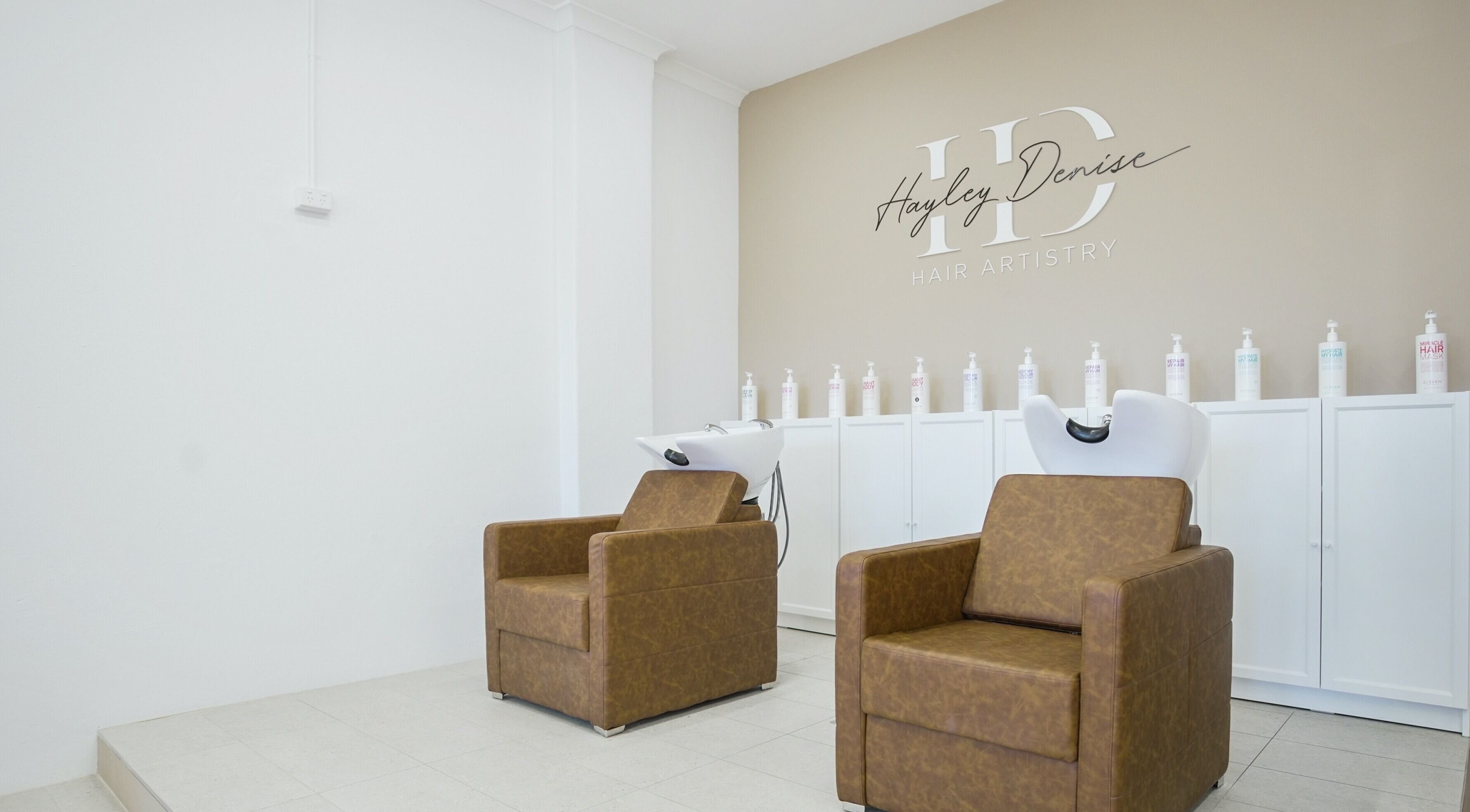 Comfortable salon chairs at HD Hair Artistry in Yokine, Western Australia, AU, showcasing a modern design.