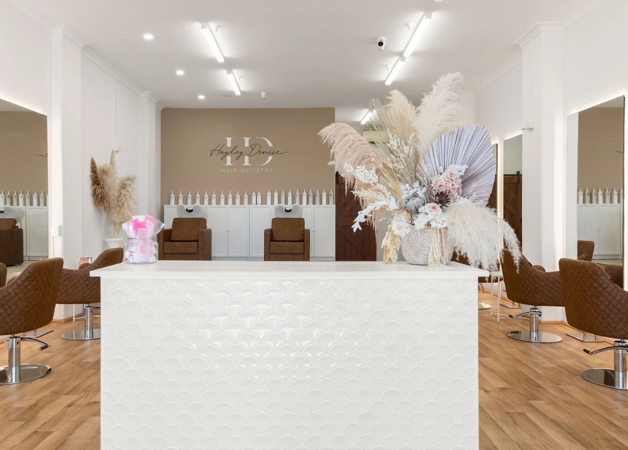 Spacious and modern interior of HD Hair Artistry in Yokine, Western Australia, AU with stylish decor and seating.